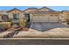 Single story home with a three car garage and desert landscaping at 3041 Bublin Bay Ave, North Las Vegas, NV 89081