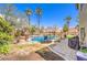 Inviting backyard oasis with a sparkling pool and patio at 3241 Rainmaker St, Las Vegas, NV 89129