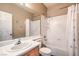 Clean bathroom with a shower/tub combo and wood vanity at 3241 Rainmaker St, Las Vegas, NV 89129