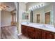 Double vanity bathroom with dark wood cabinets at 3241 Rainmaker St, Las Vegas, NV 89129