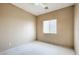 Well-lit bedroom with neutral walls and carpet at 3241 Rainmaker St, Las Vegas, NV 89129