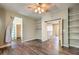 Bedroom with wood-look floors, ceiling fan, and access to loft at 3241 Rainmaker St, Las Vegas, NV 89129