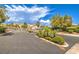 Gated community entrance with lush landscaping and mountain views at 3241 Rainmaker St, Las Vegas, NV 89129