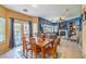 Dining area with wooden table and chairs, near kitchen at 3241 Rainmaker St, Las Vegas, NV 89129