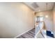 Upstairs hallway with laminate flooring and neutral walls at 3241 Rainmaker St, Las Vegas, NV 89129