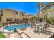 Enjoy entertaining in this expansive backyard with a sparkling pool and patio seating at 3241 Rainmaker St, Las Vegas, NV 89129