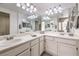 Double vanity bathroom with bright lighting and mirrors at 337 Seine Way # 0, Henderson, NV 89014