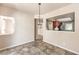 Bright dining room with kitchen view and contemporary light fixture at 337 Seine Way # 0, Henderson, NV 89014