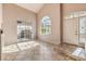 Bright entryway with high ceilings, tile floors, and sliding glass door to backyard at 337 Seine Way # 0, Henderson, NV 89014