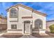 Two-story stucco home with arched windows and walkway at 337 Seine Way # 0, Henderson, NV 89014