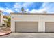 Attached garage with tan overhead door at 337 Seine Way # 0, Henderson, NV 89014