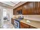 Updated kitchen featuring stainless steel appliances and laundry access at 337 Seine Way # 0, Henderson, NV 89014