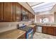 Modern kitchen with stainless steel appliances and wood cabinets at 337 Seine Way # 0, Henderson, NV 89014