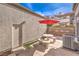 Private patio with table, umbrella, and artificial turf at 337 Seine Way # 0, Henderson, NV 89014