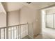 Upstairs hall with white railing and wood floors at 337 Seine Way # 0, Henderson, NV 89014