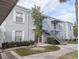 Two story condo featuring white trim windows, exterior stairs, and green landscaping at 3823 S Maryland Pkwy # C3, Las Vegas, NV 89119