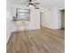 Open floor plan living room with breakfast bar and laminate wood floors at 3823 S Maryland Pkwy # C3, Las Vegas, NV 89119