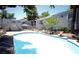 Community pool surrounded by lounge chairs at 3823 S Maryland Pkwy # C3, Las Vegas, NV 89119