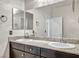 Double vanity bathroom with granite countertops at 4165 Kerberos Ave, North Las Vegas, NV 89084