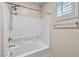 Bathroom with shower/tub combo and tile surround at 4165 Kerberos Ave, North Las Vegas, NV 89084