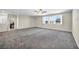 Spacious bedroom with carpet, ceiling fan and large windows at 4165 Kerberos Ave, North Las Vegas, NV 89084