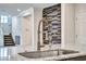 Modern kitchen sink with pull-down faucet and filtered water dispenser at 4165 Kerberos Ave, North Las Vegas, NV 89084