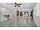 Open living room with tile flooring, high ceilings and a view of the kitchen at 4165 Kerberos Ave, North Las Vegas, NV 89084