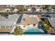 Aerial view of house with pool and solar panels in a suburban neighborhood at 4321 Mott Cir, Las Vegas, NV 89102