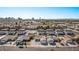 An aerial view of a neighborhood with the city skyline in the distance under a clear blue sky at 4321 Mott Cir, Las Vegas, NV 89102