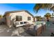 Backyard patio with seating area, palm trees, and a private pool at 4321 Mott Cir, Las Vegas, NV 89102