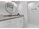 Stylish bathroom with a modern vanity, round mirror, and sleek fixtures at 4321 Mott Cir, Las Vegas, NV 89102