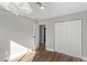 Well-lit bedroom features wood-look flooring and a closet with sliding doors at 4321 Mott Cir, Las Vegas, NV 89102