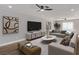 Cozy living room features recessed lighting, modern ceiling fan, contemporary decor and access to the backyard at 4321 Mott Cir, Las Vegas, NV 89102