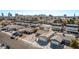 A street view of single-story houses, one with solar panels, set against the backdrop of the city skyline at 4321 Mott Cir, Las Vegas, NV 89102