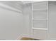 Bright walk-in closet with built-in shelving and wood-look flooring at 4321 Mott Cir, Las Vegas, NV 89102