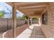 Cozy covered patio and backyard space with easy-care rock landscaping at 4507 Golden Palomino Ln, North Las Vegas, NV 89032