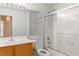 Bathroom featuring a large mirror, vanity, toilet, and shower with glass doors at 4507 Golden Palomino Ln, North Las Vegas, NV 89032