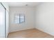 Bright bedroom with wood-look floors, closet, and window offering natural light at 4507 Golden Palomino Ln, North Las Vegas, NV 89032