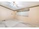 Spacious bedroom with ceiling fan and neutral color scheme at 4507 Golden Palomino Ln, North Las Vegas, NV 89032