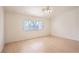 Well-lit bedroom features hardwood-style floors and a large window with natural lighting at 4507 Golden Palomino Ln, North Las Vegas, NV 89032