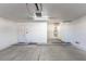 Large garage with entry door, storage space, and painted walls at 4507 Golden Palomino Ln, North Las Vegas, NV 89032
