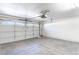 Spacious garage with a white door and an automatic door opener at 4507 Golden Palomino Ln, North Las Vegas, NV 89032