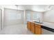 Bright kitchen with updated cabinets, countertop and stainless steel sink overlooking an ample dining area at 4507 Golden Palomino Ln, North Las Vegas, NV 89032