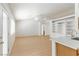 Bright, open living room features light wood floors, ceiling fan, and convenient built-in shelving at 4507 Golden Palomino Ln, North Las Vegas, NV 89032