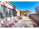 Backyard patio with covered pergola and two chairs at 4507 Golden Palomino Ln, North Las Vegas, NV 89032