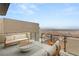 Expansive balcony with comfortable seating and stunning panoramic city views at 506 Overlook Rim Dr, Henderson, NV 89012