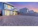 Contemporary home featuring desert landscaping, modern design, balconies, and large picture windows at 506 Overlook Rim Dr, Henderson, NV 89012