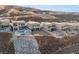 Modern homes with backyard pools are nestled into a hillside development at 506 Overlook Rim Dr, Henderson, NV 89012