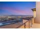 This home features a balcony with stunning city views and glass railings for unobstructed sightlines at 506 Overlook Rim Dr, Henderson, NV 89012