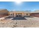 View of backyard featuring a covered patio and low-maintenance desert landscaping at 5582 Little Lake Ave, Las Vegas, NV 89122